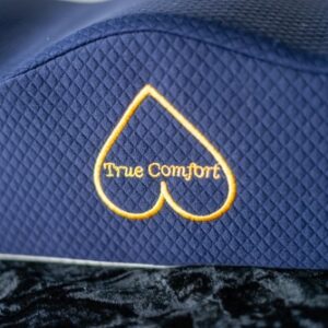 A blue hat with the words " true comfort " embroidered on it.