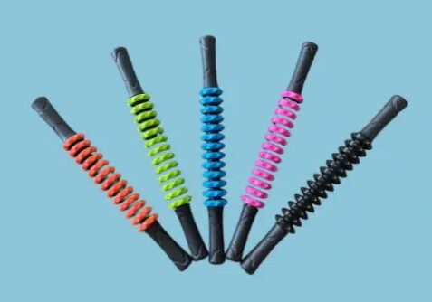 A group of five different colored grips on top of each other.